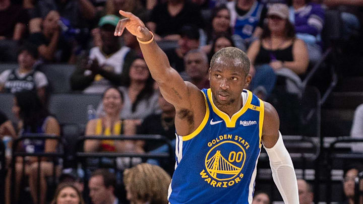 Golden State Warriors forward Jonathan Kuminga (00) points to his teammates after making a three-point shot during the second quarter against the Sacramento Kings at Golden 1 Center. Mandatory Credit: 