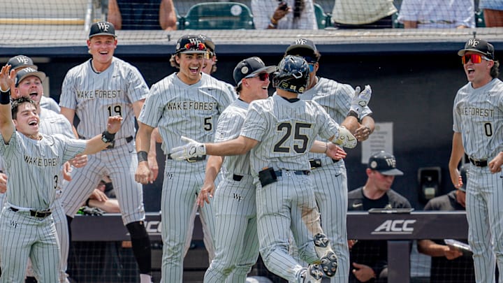 Wake Forest celebrates outside the dugout against the Georgia Tech Yellow Jackets.