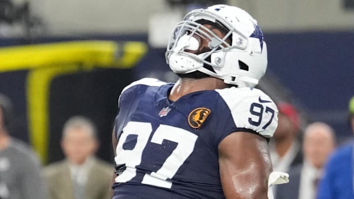 Nov 28, 2024; Arlington, Texas, USA;  Dallas Cowboys defensive tackle Osa Odighizuwa (97) celebrates after a sack against the New York Giants during the second half at AT&T Stadium. Mandatory Credit: Chris Jones-Imagn Images