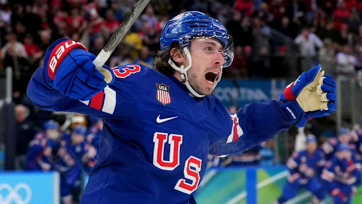 Feb 18, 2026; Milan, Italy; Quinn Hughes (43) of the United States celebrates his winning goal in overtime against Sweden in a men's ice hockey quarterfinal during the Milano Cortina 2026 Olympic Winter Games at Milano Santagiulia Ice Hockey Arena. Mandatory Credit: Amber Searls-Imagn Images