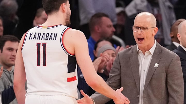 Mar 13, 2025; New York, NY, USA;  Connecticut Huskies head coach Dan Hurley greets Connecticut Huskies forward Alex Karaban (11) after he left the game late in the 2nd half against the Villanova Wildcats at Madison Square Garden. Mandatory Credit: Robert Deutsch-Imagn Images