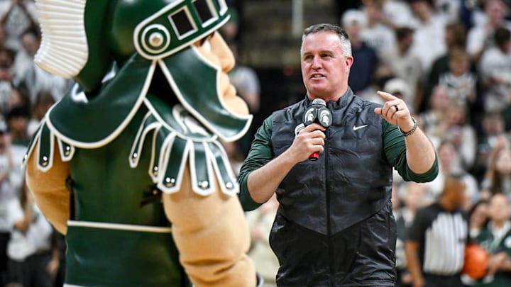 Michigan State's new football coach Pat Fitzgerald addresses the crowd during a timeout in the first half of the Spartans basketball game against Iowa on Tuesday, Dec. 2, 2025, at the Breslin Center in East Lansing.