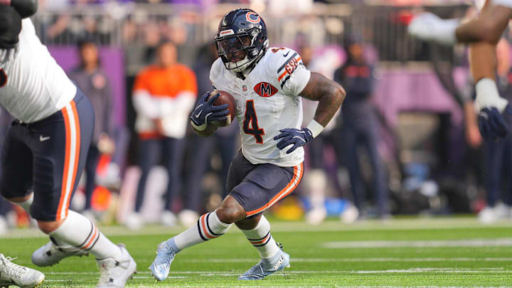 Nov 16, 2025; Minneapolis, Minnesota, USA; Chicago Bears running back D'Andre Swift (4) runs for a gain during the second quarter against the Minnesota Vikings at U.S. Bank Stadium. Mandatory Credit: Brad Rempel-Imagn Images