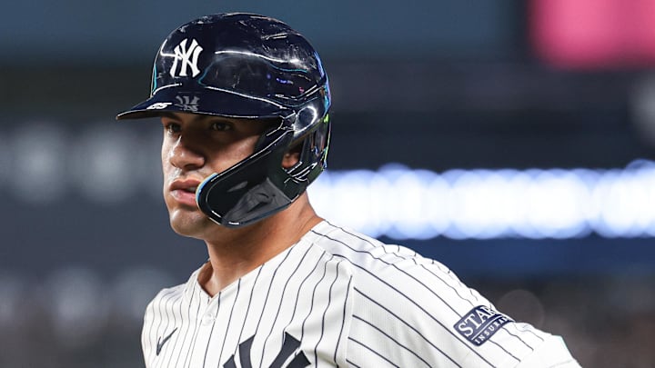 Jul 5, 2024; Bronx, New York, USA;  New York Yankees second baseman Gleyber Torres (25) reacts after safely reaching first base on an infield single during the fourth inning against the Boston Red Sox at Yankee Stadium. Torres would leave the game with an injury after the play. Mandatory Credit: Vincent Carchietta-Imagn Images