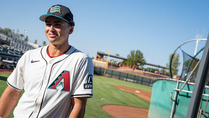 Second baseman, Tommy Troy speaks to a vendor at Arizona Fall League media day at Scottsdale Stadium on Oct. 4, 2024, in Scottsdale, Arizona.