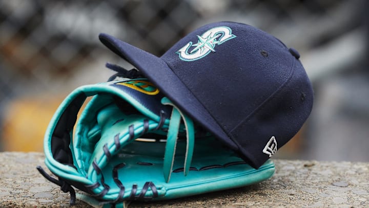 Hat and glove of Seattle Mariners center fielder Dee Gordon (9) sits in dugout during the third inning against the Detroit Tigers at Comerica Park in 2018.