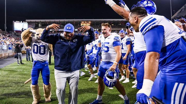 Oct 11, 2025; Tucson, Arizona, USA; Brigham Young Cougars head coach Kalani Sitake celebrates a win against the Arizona Wildcats after overtime with his team at Arizona Stadium. Mandatory Credit: Aryanna Frank-Imagn Images Oct 11, 2025; Tucson, Arizona, USA; Brigham Young Cougars head coach Kalani Sitake celebrates a win against the Arizona Wildcats after overtime with his team at Arizona Stadium. Mandatory Credit: Aryanna Frank-Imagn Images