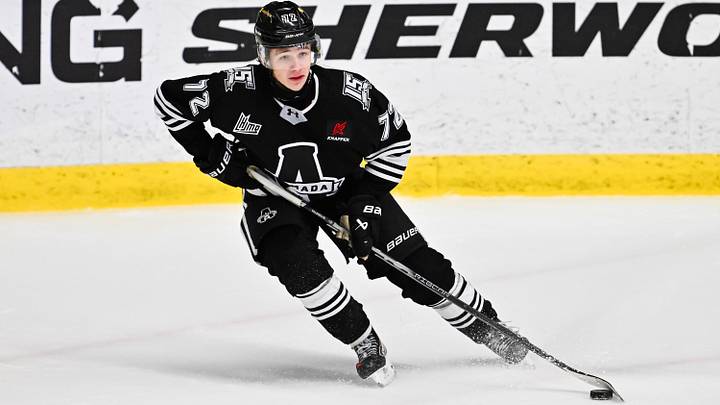 BOISBRIAND, CANADA - DECEMBER 05: Xavier Villeneuve #72 of the Blainville-Boisbriand Armada handles the puck during the third period against the Rimouski Océanic at Centre d'Excellence Sports Rousseau on December 5, 2025 in Boisbriand, Canada.