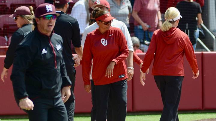Oklahoma associate head coach Jennifer Rocha, center, and head coach Patty Gasso, right, head back to the dugout after falling to Mississippi State in Game 1 of the Norman Super Regional. Oklahoma associate head coach Jennifer Rocha, center, and head coach Patty Gasso, right, head back to the dugout after falling to Mississippi State in Game 1 of the Norman Super Regional.