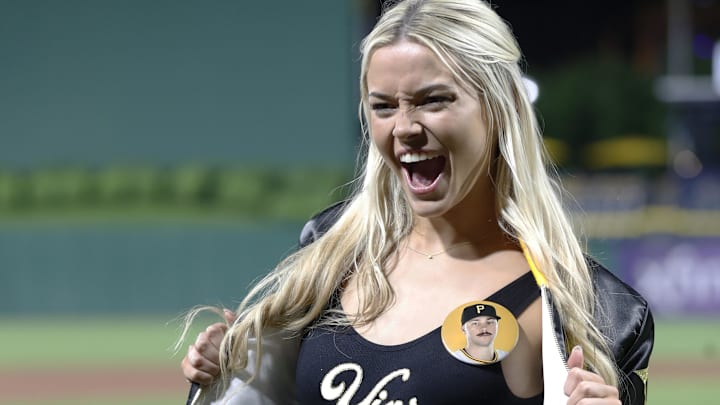 Livvy Dunne reacts on the field after her boyfriend Pittsburgh Pirates starting pitcher Paul Skenes (not pictured) made his major league debut against the Chicago Cubs at PNC Park. Livvy Dunne reacts on the field after her boyfriend Pittsburgh Pirates starting pitcher Paul Skenes (not pictured) made his major league debut against the Chicago Cubs at PNC Park.