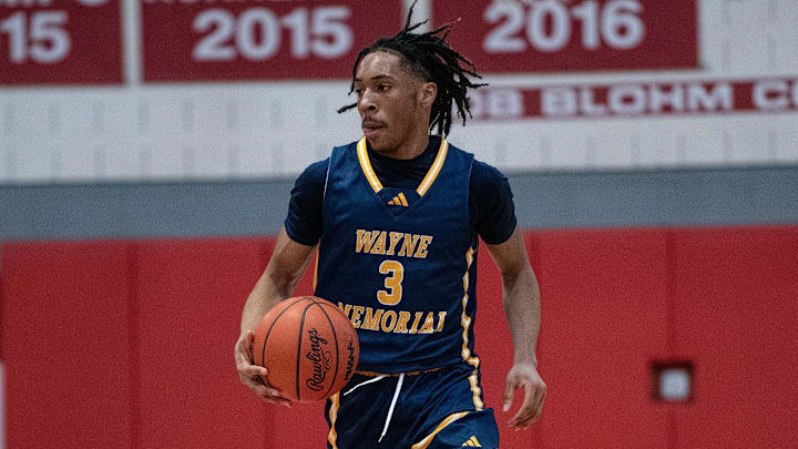 Wayne Memorial's Carlos Medlock dribbles up the floor during a Division 1 boys basketball district championship on Friday, March 1, 2024.
