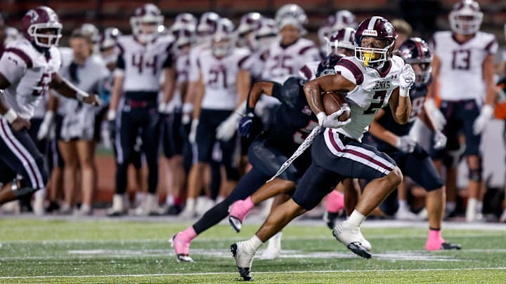 Jenks’ Kaydin Jones (2) runs for a touchdown during a high school football game between Mustang and Jenks in Mustang, Okla., on Friday, Oct. 11, 2024. Jenks’ Kaydin Jones (2) runs for a touchdown during a high school football game between Mustang and Jenks in Mustang, Okla., on Friday, Oct. 11, 2024.