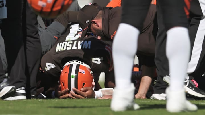 Oct 20, 2024; Cleveland, Ohio, USA; Cleveland Browns quarterback Deshaun Watson (4) lies on the ground after being injured during the first half against the Cincinnati Bengals at Huntington Bank Field. Mandatory Credit: Ken Blaze-Imagn Images