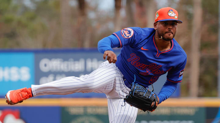 Feb 17, 2026; Port St. Lucie, FL, USA;  New York Mets pitcher Freddy Peralta (51) throws a pitch during the New York Mets spring training workouts at Clover Park. Mandatory Credit: Reinhold Matay-Imagn Images