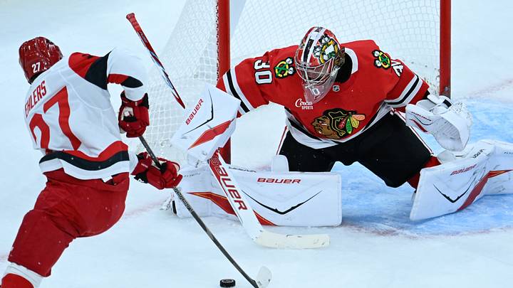 Carolina Hurricanes' Nikolaj Ehlers (27) shoots against Chicago Blackhawks goaltender Spencer Knight (30) during the second period at the United Center.  Mandatory Credit: Matt Marton-Imagn Images