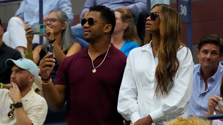 Russell Wilson and Ciara attending a tennis match. Russell Wilson and Ciara attending a tennis match.