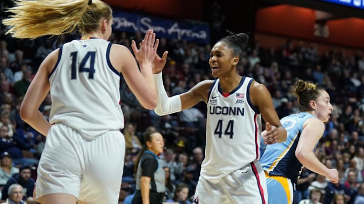 Mar 5, 2023; Uncasville, CT, USA; UConn Huskies forward Aubrey Griffin (44) reacts after forward Dorka Juhasz (14) blocks the shot of the Marquette Golden Eagles in the second half at Mohegan Sun Arena. Mandatory Credit: David Butler II-Imagn Images Mar 5, 2023; Uncasville, CT, USA; UConn Huskies forward Aubrey Griffin (44) reacts after forward Dorka Juhasz (14) blocks the shot of the Marquette Golden Eagles in the second half at Mohegan Sun Arena. Mandatory Credit: David Butler II-Imagn Images