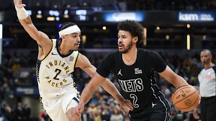 Mar 22, 2025; Indianapolis, Indiana, USA; Brooklyn Nets forward Cameron Johnson (2) goes to the basket against Indiana Pacers guard Andrew Nembhard (2) during the second half at Gainbridge Fieldhouse. Mandatory Credit: Robert Goddin-Imagn Images