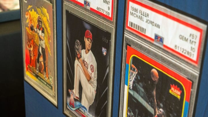 Card collectors check out the items for sale duing Cards on the Coast Sports Card and TCG Show Saturday, Sept. 27, 2025