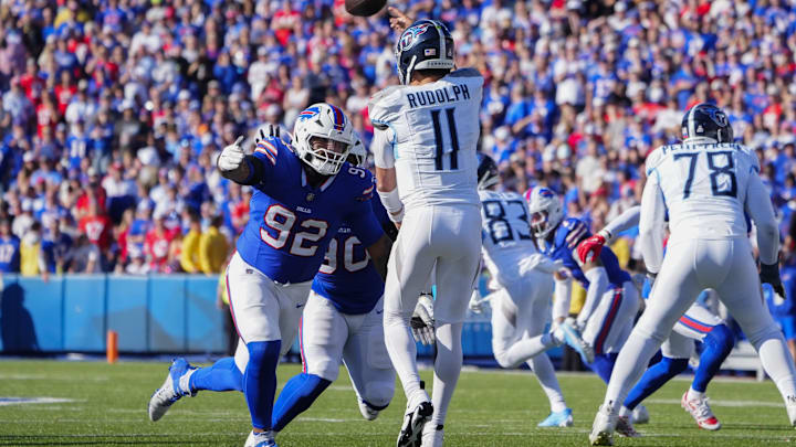 Oct 20, 2024; Orchard Park, New York, USA; Buffalo Bills defensive tackle DaQuan Jones (92) pressures Tennessee Titans quarterback Mason Rudolph (11) during the second half at Highmark Stadium.