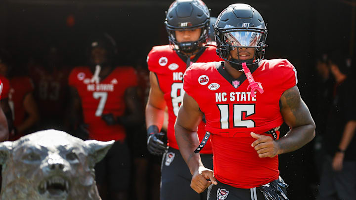 Oct 5, 2024; Raleigh, North Carolina, USA;  North Carolina State Wolfpack cornerback Tamarcus Cooley (15) runs out prior to the first half of the game against Wake Forest Demon Deacons at Carter-Finley Stadium. Mandatory Credit: Jaylynn Nash-Imagn Images