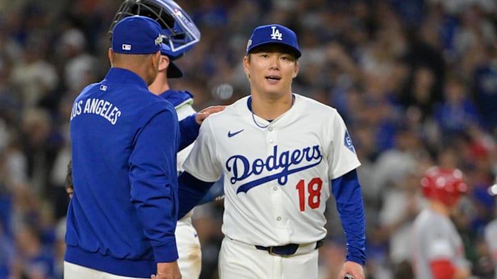 Oct 1, 2025; Los Angeles, California, USA; Los Angeles Dodgers manager Dave Roberts (30) relieves starting pitcher Yoshinobu Yamamoto (18) in the seventh inning against the Cincinnati Reds during game two of the Wildcard round for the 2025 MLB playoffs at Dodger Stadium. Mandatory Credit: Jayne Kamin-Oncea-Imagn Images