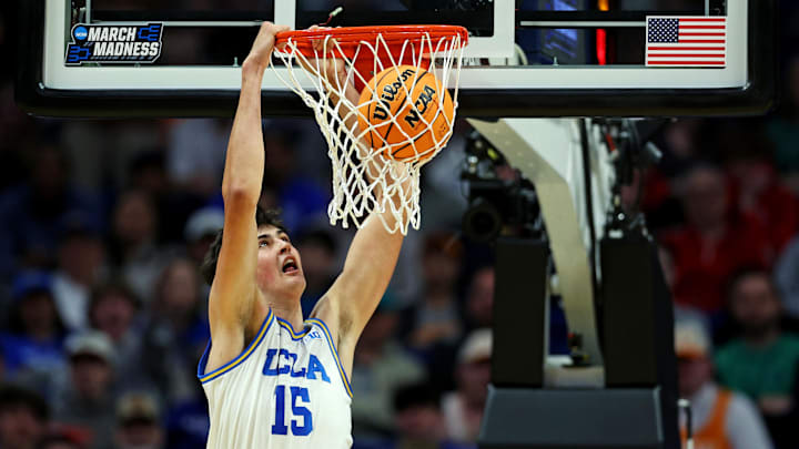 Mar 20, 2025; Lexington, KY, USA;  UCLA Bruins center Aday Mara (15) dunks the ball during the first half against the Utah State Aggies in the first round of the NCAA Tournament at Rupp Arena. Mandatory Credit: Aaron Doster-Imagn Images