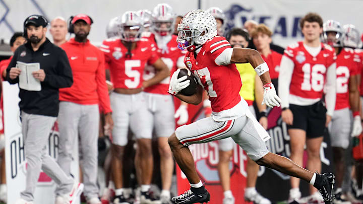 Ohio State Buckeyes wide receiver Carnell Tate (17) runs after a catch during the Cotton Bowl at AT&T Stadium in Arlington, Texas for the College Football Playoff quarterfinal game against the Miami Hurricanes on Dec. 31, 2025. Ohio State lost 24-14.
