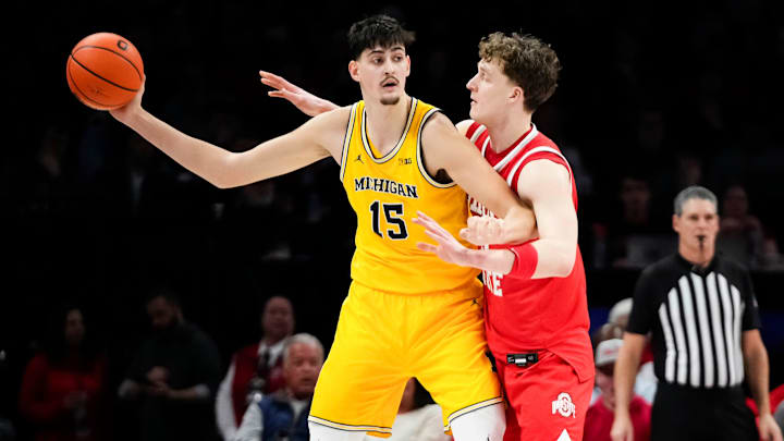 Ohio State Buckeyes center Christoph Tilly (13) defends Michigan Wolverines center Aday Mara (15) during the first half of the NCAA men's basketball game at the Schottenstein Center in Columbus on Feb. 8, 2026.