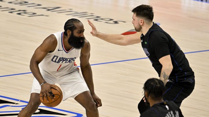 May 3, 2024; Dallas, Texas, USA; LA Clippers guard James Harden (1) looks to move the ball past Dallas Mavericks guard Luka Doncic (77) during the fourth quarter during game six of the first round for the 2024 NBA playoffs at American Airlines Center. Mandatory Credit: Jerome Miron-USA TODAY Sports