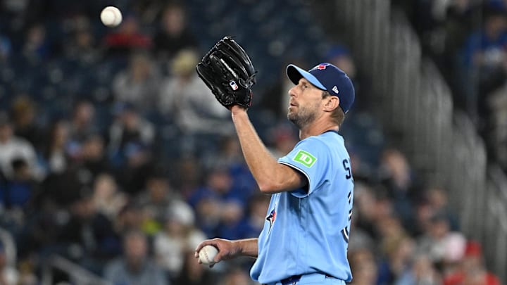 Mar 31, 2026; Toronto, Ontario, CAN;  Toronto Blue Jays starting pitcher Max Scherzer (31) receives a new ball in the fourth inning against the Colorado Rockies at Rogers Centre. Mandatory Credit: Dan Hamilton-Imagn Images