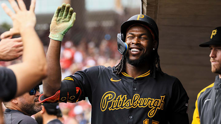 Sep 22, 2024; Cincinnati, Ohio, USA; Pittsburgh Pirates outfielder Oneil Cruz (15) high fives teammates after hitting a solo home run in the first inning against the Cincinnati at Great American Ball Park. Mandatory Credit: Katie Stratman-Imagn Images