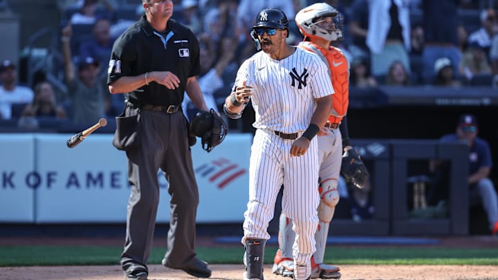 Aug 9, 2025; Bronx, New York, USA;  New York Yankees center fielder Trent Grisham (12) hits a solo home run in the eighth inning against the Houston Astros at Yankee Stadium. Mandatory Credit: Wendell Cruz-Imagn Images