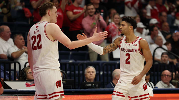 Nov 27, 2025; San Diego, CA, USA; Wisconsin Badgers guard Nick Boyd (2) reacts with Wisconsin Badgers forward Austin Rapp (22) after scoring against the Providence Friars during the second half at Jenny Craig Pavilion. Mandatory Credit: Abe Arredondo-Imagn Images