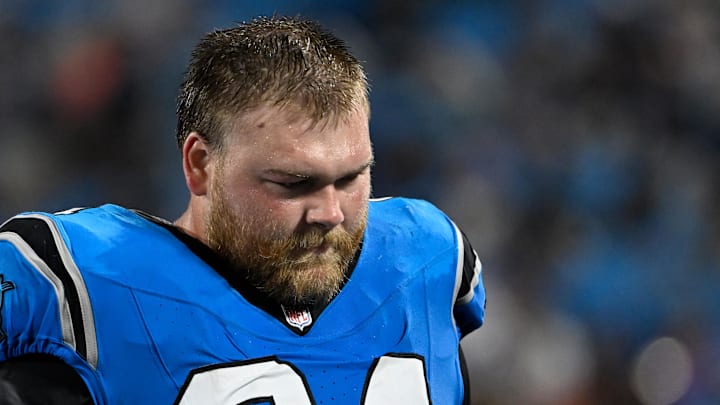 Aug 8, 2025; Charlotte, North Carolina, USA; Carolina Panthers center Cade Mays (64) on the sidelines in the fourth quarter at Bank of America Stadium. Mandatory Credit: Bob Donnan-Imagn Images