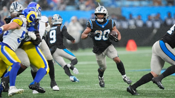 Nov 30, 2025; Charlotte, North Carolina, USA; Carolina Panthers running back Chuba Hubbard (30) rushes during the fourth quarter against the Los Angeles Rams at Bank of America Stadium. Mandatory Credit: Jim Dedmon-Imagn Images