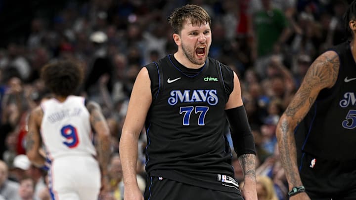Mar 3, 2024; Dallas, Texas, USA; Dallas Mavericks guard Luka Doncic (77) celebrates after he makes a three point shot against the Philadelphia 76ers during the second half at the American Airlines Center. Mandatory Credit: Jerome Miron-Imagn Images
