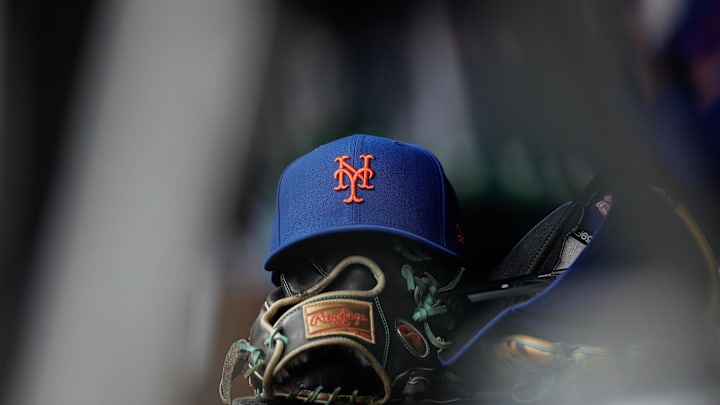 Aug 8, 2024; Denver, Colorado, USA; A New York Mets hat and glove in the dugout in the second inning against the Colorado Rockies at Coors Field. Mandatory Credit: Isaiah J. Downing-Imagn Images