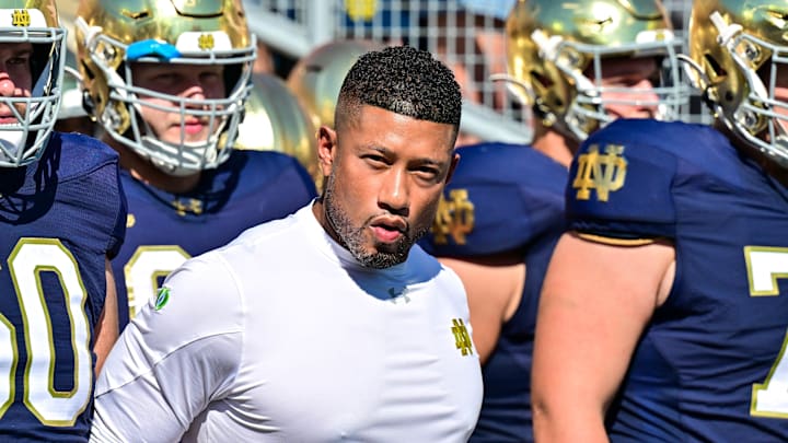 Sep 21, 2024; South Bend, Indiana, USA; Notre Dame Fighting Irish head coach Marcus Freeman prepares to lead his players onto the field for the game against the Miami Redhawks at Notre Dame Stadium. Mandatory Credit: Matt Cashore-Imagn Images