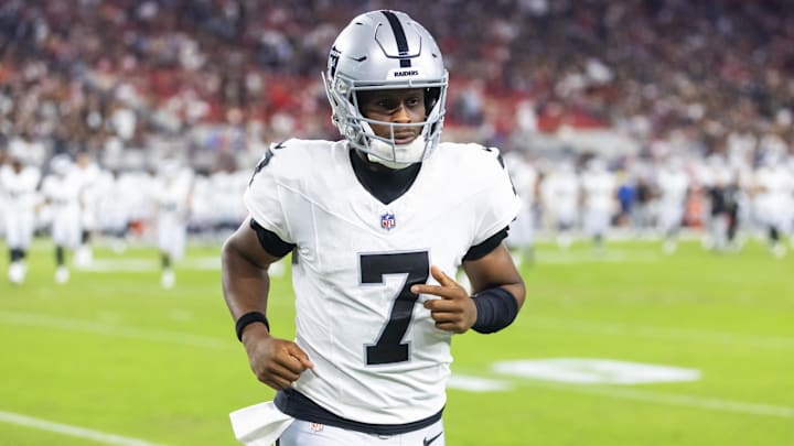 Aug 23, 2025; Glendale, Arizona, USA; Las Vegas Raiders quarterback Geno Smith (7) against the Arizona Cardinals during a preseason NFL game at State Farm Stadium. Mandatory Credit: Mark J. Rebilas-Imagn Images