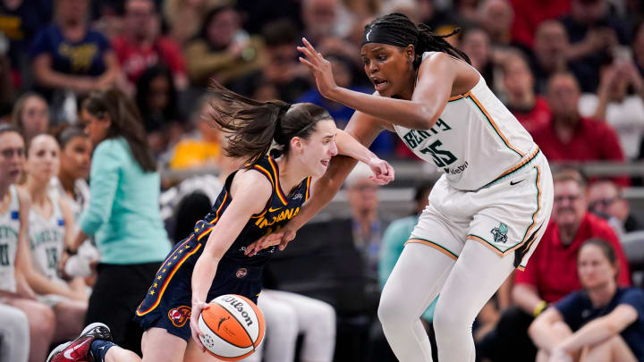 Indiana Fever guard Caitlin Clark (22) drives the lane past New York Liberty forward Jonquel Jones (35) on Thursday, May 16, 2024, during the Indiana Fever home opener game against the New York Liberty at Gainbridge Fieldhouse in Indianapolis. Indiana Fever guard Caitlin Clark (22) drives the lane past New York Liberty forward Jonquel Jones (35) on Thursday, May 16, 2024, during the Indiana Fever home opener game against the New York Liberty at Gainbridge Fieldhouse in Indianapolis.