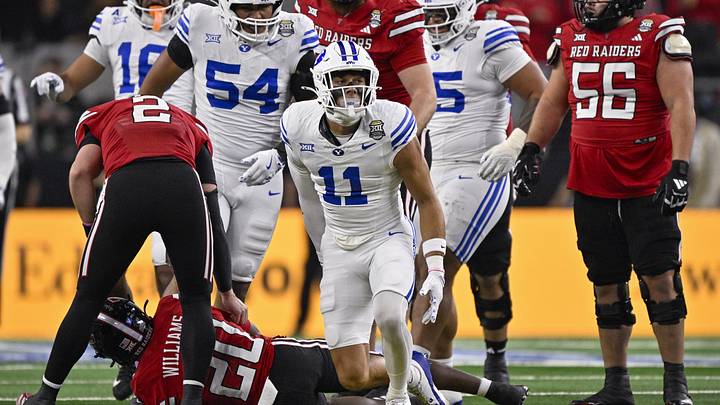 Dec 6, 2025; Arlington, TX, USA; BYU Cougars safety Faletau Satuala (11) celebrates during the game between the Red Raiders and the Cougars at AT&T Stadium. Mandatory Credit: Jerome Miron-Imagn Images