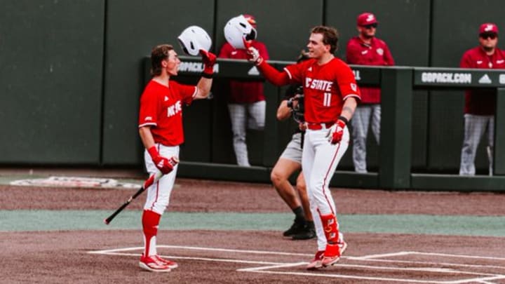 NC State left fielder Rett Johnson greets catcher Preston Bonn at the plate after Bonn's solo home run in the 14-4 win over Lafayette on March 8, 2026. 