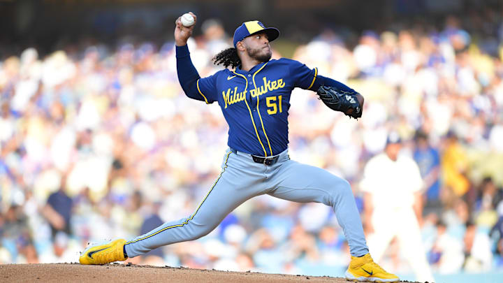 Jul 19, 2025; Los Angeles, California, USA; Milwaukee Brewers starting pitcher Freddy Peralta (51) throws during the first inning against the Los Angeles Dodgers at Dodger Stadium. Mandatory Credit: Gary A. Vasquez-Imagn Images