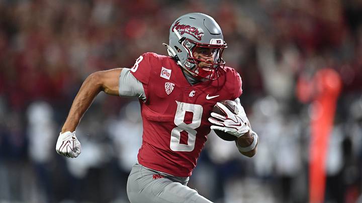Washington State Cougars wide receiver Branden Ganashamoorthy (8) runs the ball in for a touchdown against the Arizona Wildcats during the second half at Gesa Field at Martin Stadium.
