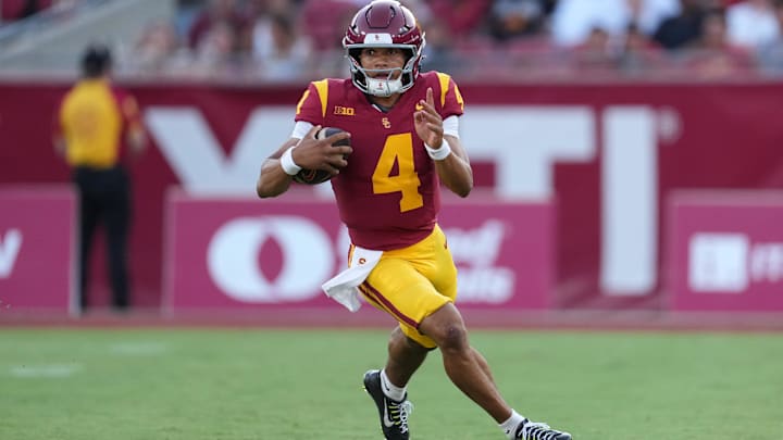 Aug 30, 2025; Los Angeles, California, USA; Southern California Trojans quarterback Husan Longstreet (4) carries the ball against the Missouri State Bears in the second half at United Airlines Field at Los Angeles Memorial Coliseum. Mandatory Credit: Kirby Lee-Imagn Images