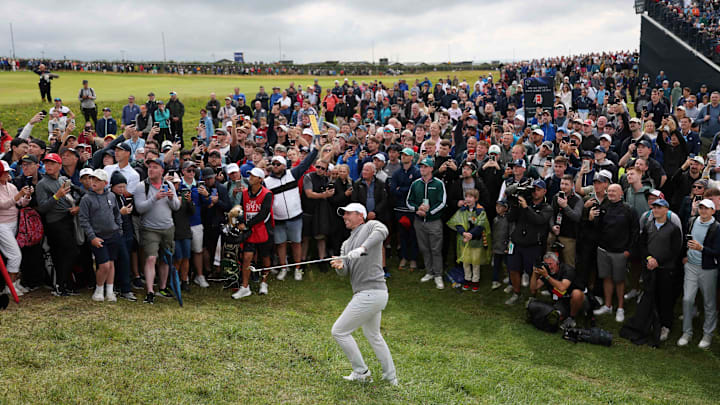 Northern Ireland's Rory McIlroy shot 1 under before massive galleries Thursday.