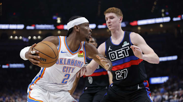 Oklahoma City Thunder guard Shai Gilgeous-Alexander (2) drives as Detroit Pistons guard Kevin Huerter (27) defends during overtime at Paycom Center. 