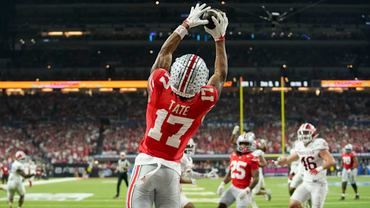 Ohio State Buckeyes wide receiver Carnell Tate (17) makes a catch for a touchdown Saturday, Dec. 6, 2025, during the Big Ten football championship against the Indiana Hoosiers at Lucas Oil Stadium in Indianapolis. Ohio State Buckeyes wide receiver Carnell Tate (17) makes a catch for a touchdown Saturday, Dec. 6, 2025, during the Big Ten football championship against the Indiana Hoosiers at Lucas Oil Stadium in Indianapolis.