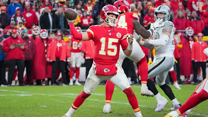 Nov 29, 2024; Kansas City, Missouri, USA; Kansas City Chiefs quarterback Patrick Mahomes (15) throws a pass against the Las Vegas Raiders during the second half at GEHA Field at Arrowhead Stadium. Mandatory Credit: Denny Medley-Imagn Images